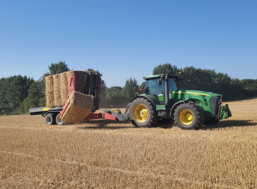 Anderson StackPro 7200 lifting a square bale with its side pickup