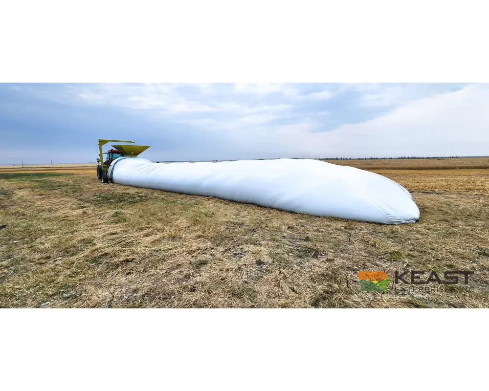 Representative RENN 10-foot grain bagger with a filled grain bag in the field