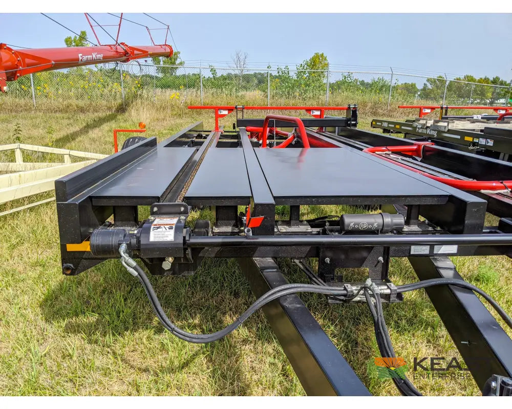 Farm King 2400 Round Bale Carrier - 8 Bale Capacity Self Loading Arm Feed Wagons