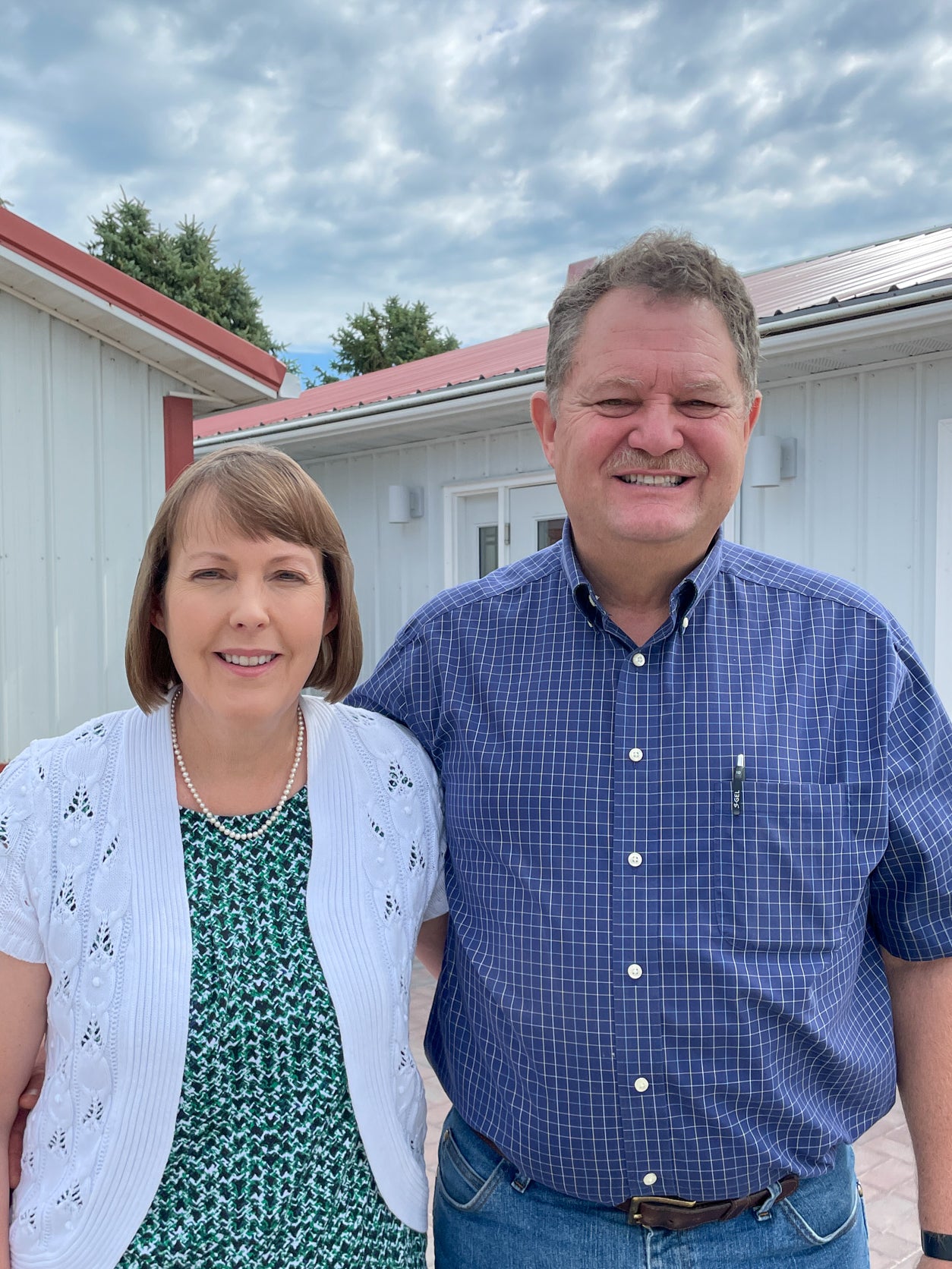 Two Keast family members outside the Keast Enterprises store