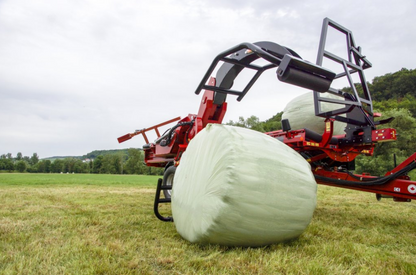 Anderson RBMPRO 1400 curved bale-gripper arms around a wrapped round bale