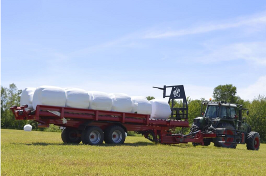 Anderson RBMPRO 2000 loaded with wrapped round bales in the field