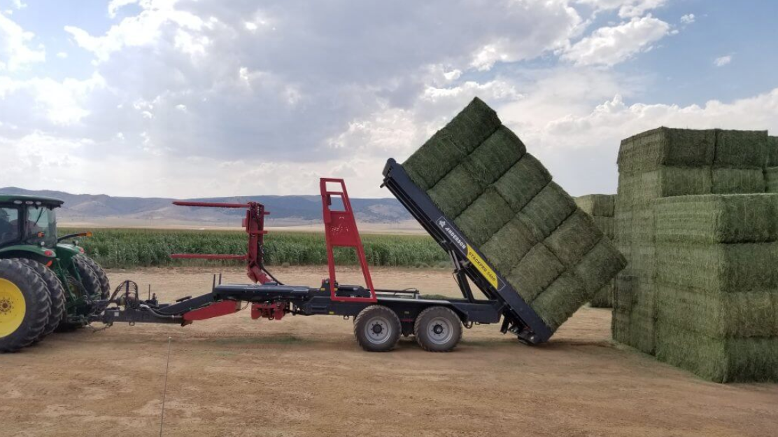 Anderson StackPro 5400 tilting a stack of square bales for unloading