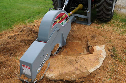 Baumalight 3P34 stump grinder cutting a broad stump behind a tractor