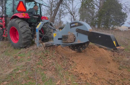 Baumalight 3P38 hydraulic-swing stump grinder working across a stump behind a tractor