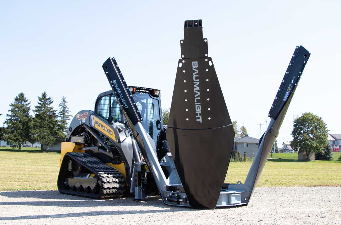 Baumalight DR448 industrial tree spade on a skid steer, whole-machine view