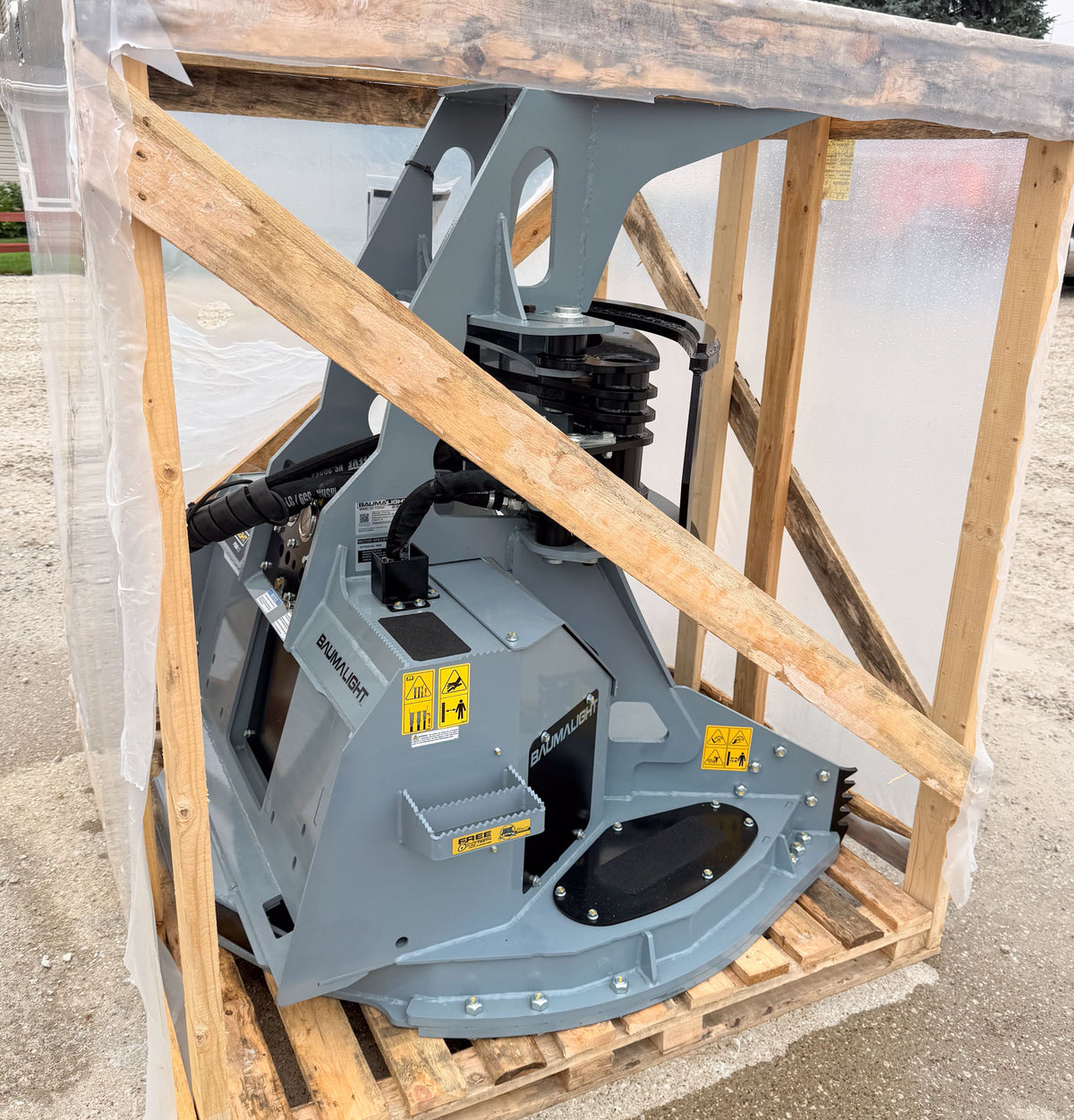 Opposite three-quarter view of the crated Baumalight FGS952 grapple saw