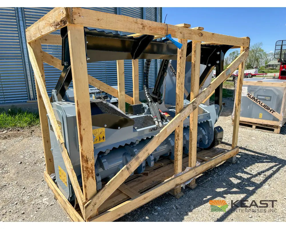 Baumalight MS972 skid steer mulcher in shipping crate, side view