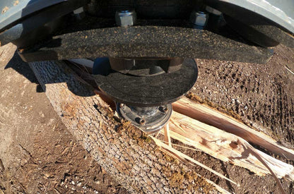 Baumalight RSS580 drive mount detail above a split log