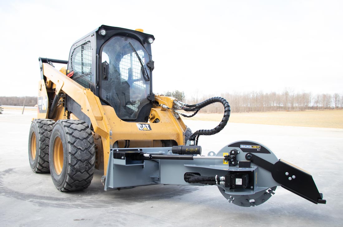 Baumalight S22 stump grinder on a skid steer, front three-quarter view