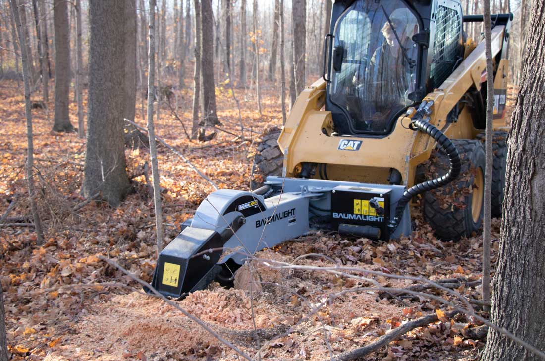 Baumalight S28 stump grinder working beside a stump in woodland