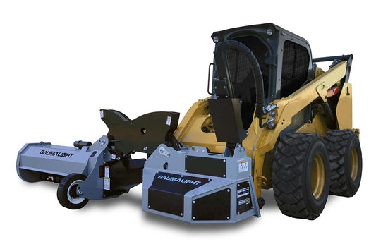 Baumalight SWA550 single-arm boom mower with the flail head at ground level, three-quarter view on a skid steer