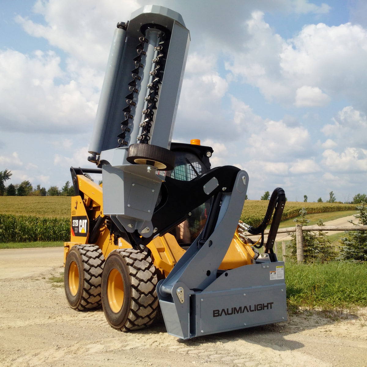 Baumalight SWF580 with boom raised and flail head vertical, rotor and cutter clusters visible