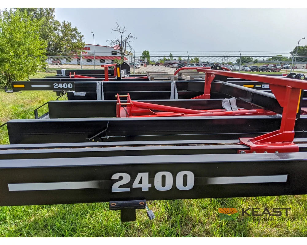 Farm King 2400 Round Bale Carrier - 8 Bale Capacity Self Loading Arm Feed Wagons