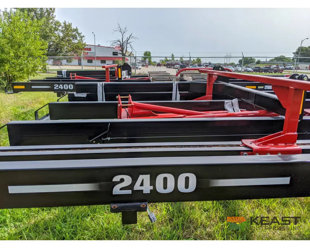 Farm King 2400 Round Bale Carrier - 8 Bale Capacity Self Loading Arm Feed Wagons