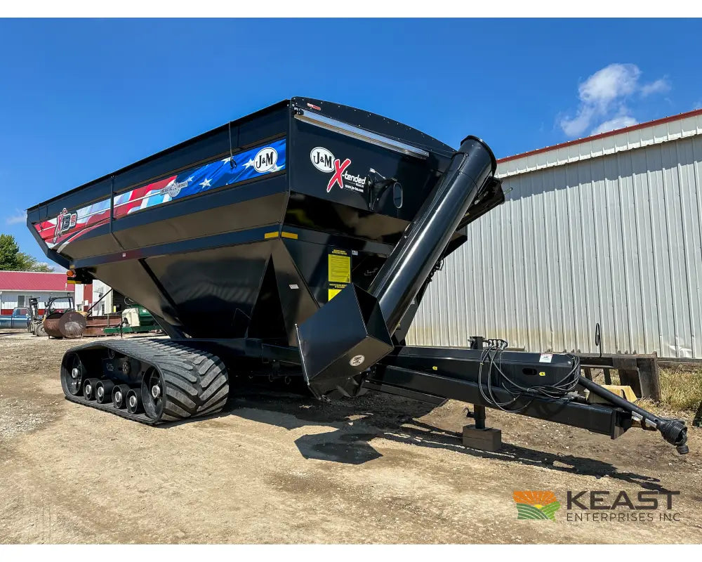 J&M 1312T Tracked Grain Cart 1,325 Bushel Capacity Roll Tarp 20’’ Discharge Scales Grain Carts