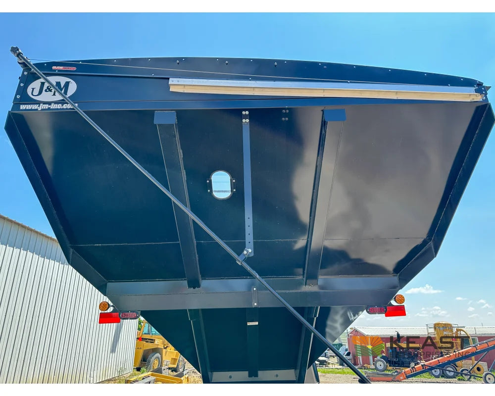 J&M 1312T Tracked Grain Cart 1,325 Bushel Capacity Roll Tarp 20’’ Discharge Scales Grain Carts